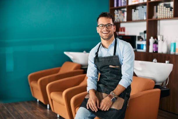 Professional salon owner in modern salon environment with stylish interior